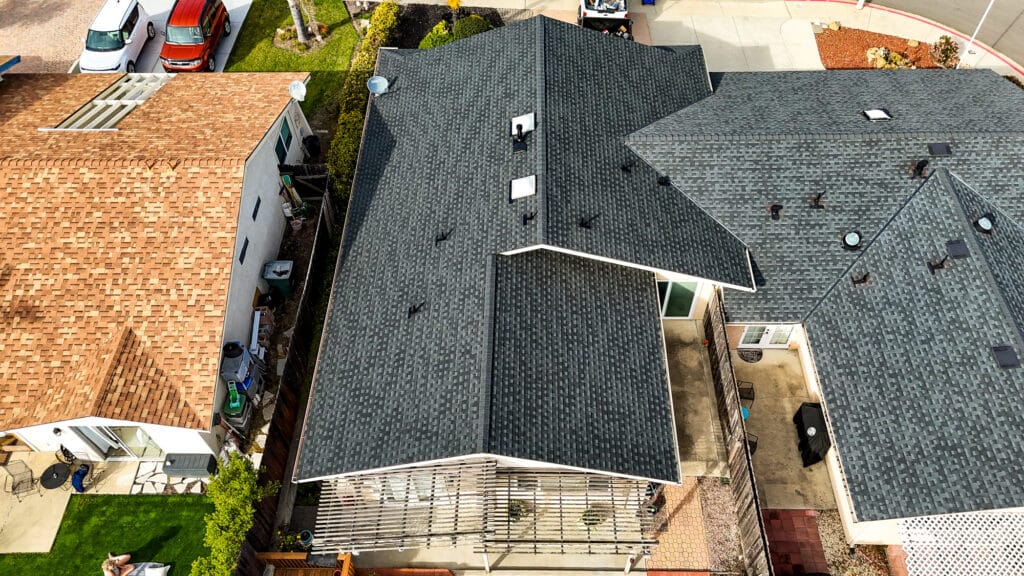 Aerial view of residential houses and roofs.