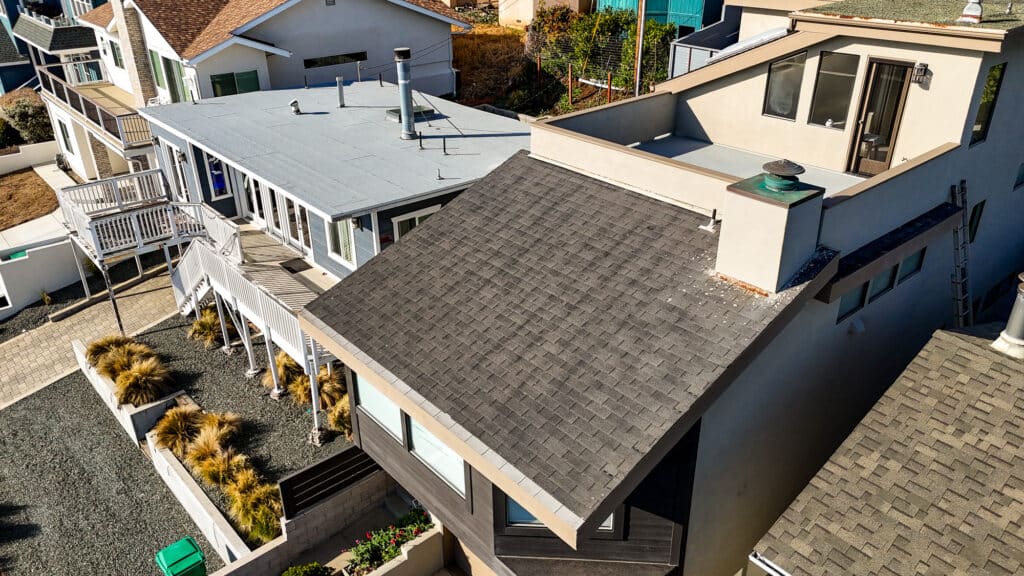 Aerial view of modern residential houses and gardens.