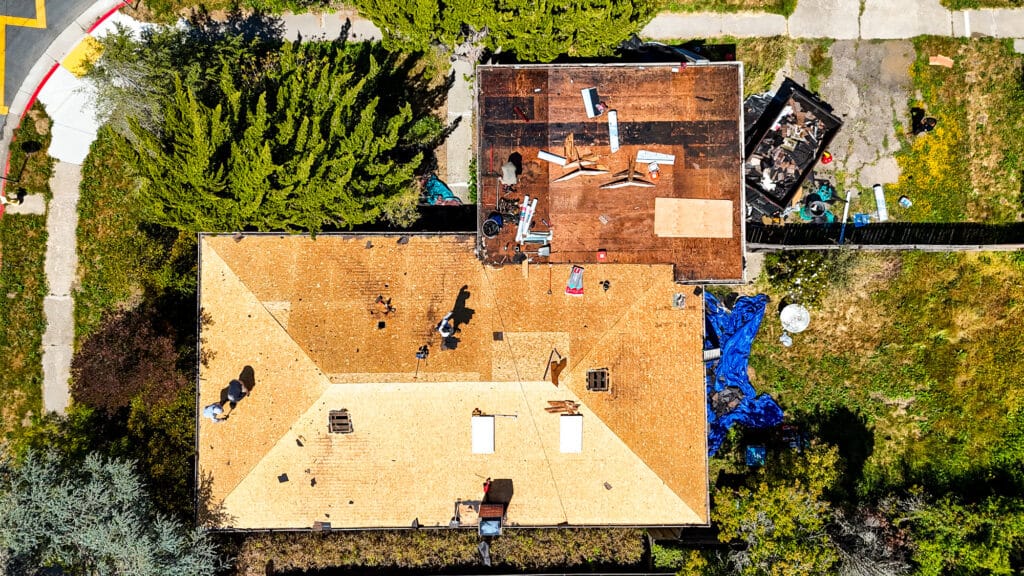 Aerial view of house roof replacement project.